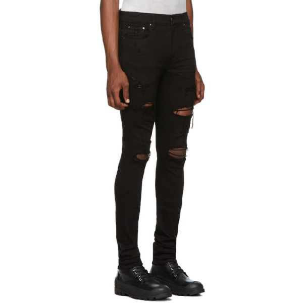 black amiri jeans with patches