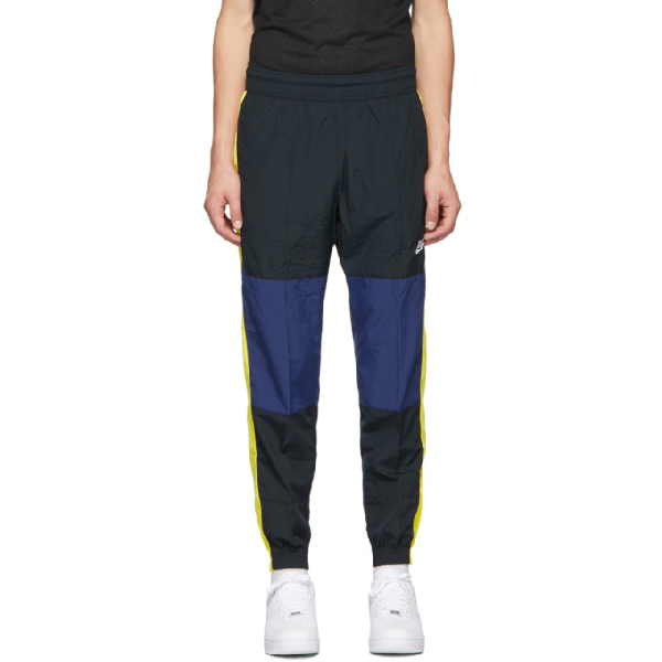 nike track pants yellow