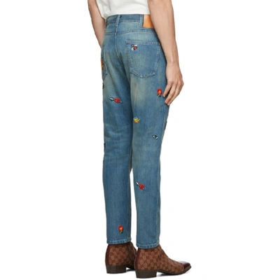 Gucci Tapered Denim Pant With Symbols In Blue | ModeSens