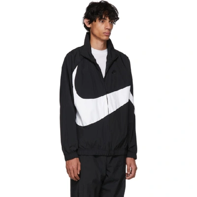Shop Nike Black And White Swoosh Jacket In 010blkwht