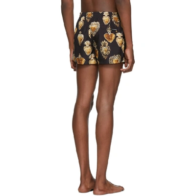 Shop Dolce & Gabbana Dolce And Gabbana Black And Gold Sacred Heart Swim Shorts In Hngg7 Black