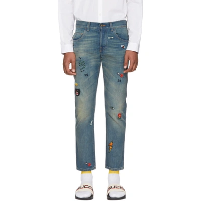 Tapered Denim Pant With Symbols In Blue