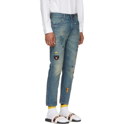 Gucci Tapered Denim Trouser With Symbols In Blue | ModeSens