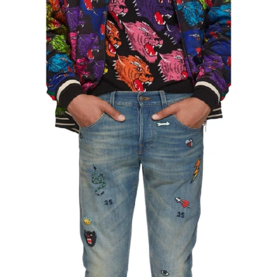 Gucci Tapered Denim Pant With Symbols In Blue | ModeSens