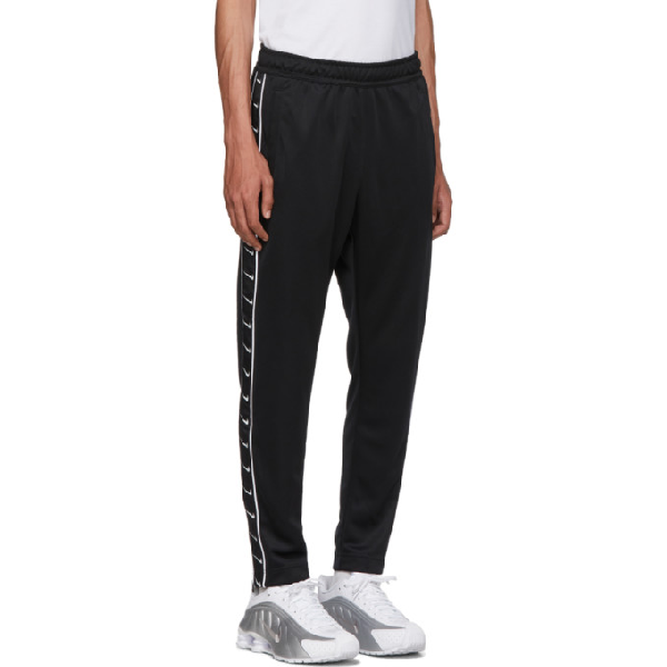 nike tape track pants black