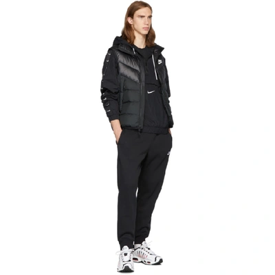 Shop Nike Black Swoosh Jacket In 010blkwht