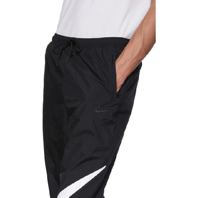 Shop Nike Black And White Swoosh Track Pants In 010blkwht