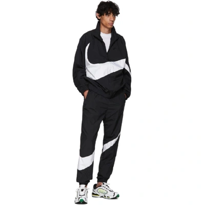 Shop Nike Black And White Swoosh Track Pants In 010blkwht