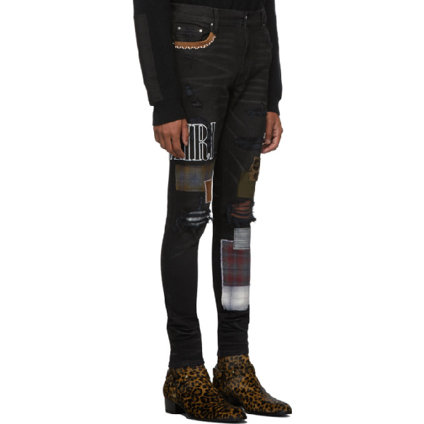 black amiri jeans with patches