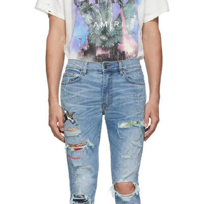 Shop Amiri Blue Art Patch Crane Jeans In Rsberosebow