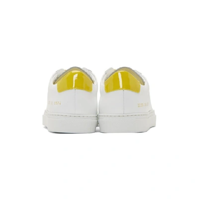 Shop Common Projects White And Yellow Retro Low Sneakers In 0574 Whtylw