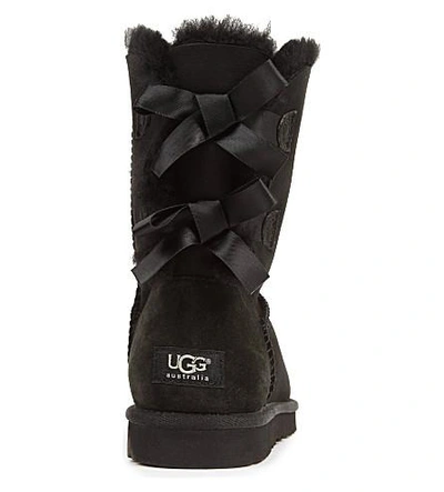 Shop Ugg Bailey Bow Sheepskin Boots In Black