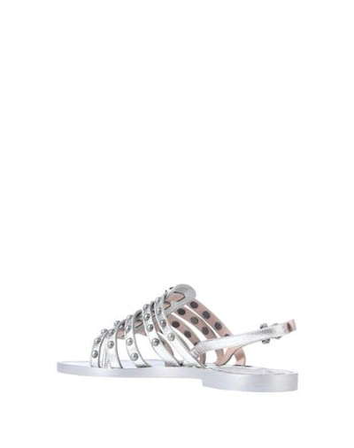 Shop Moschino Flip Flops In Silver