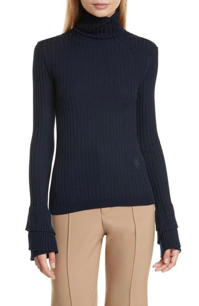 Shop Chloé Ruffle Cuff Ribbed Merino Wool Turtleneck Sweater In Evening Blue