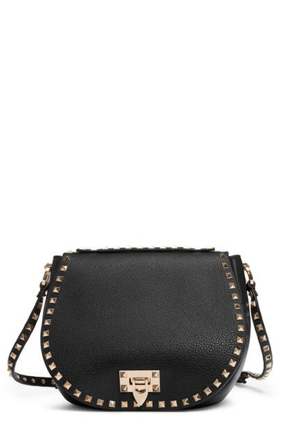 Shop Valentino Small Rockstud Leather Saddle Bag In Nero