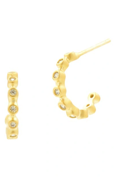 Shop Freida Rothman Signature Bezel Huggie Hoop Earrings In Gold