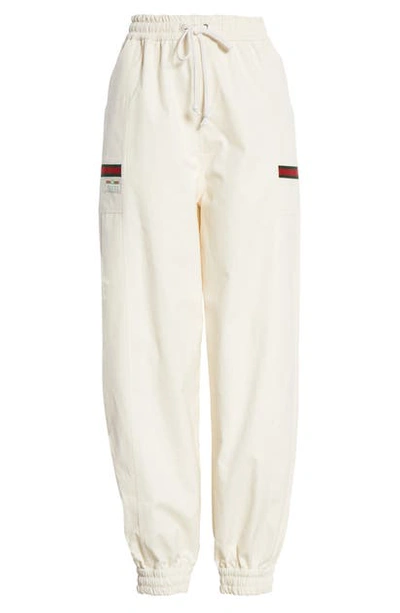 Shop Gucci Logo Label Cotton Track Pants In Ivory/ Multicolor