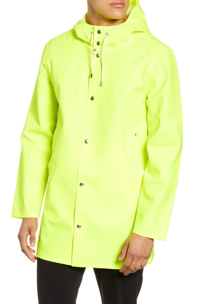 Shop Stutterheim Stockholm Waterproof Hooded Raincoat In Safety Yellow