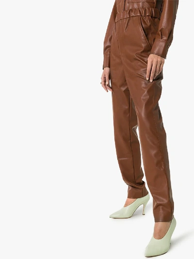 Shop Tibi Straight Leg Faux Leather Trousers In Brown