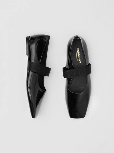 Shop Burberry Logo Detail Patent Leather Flats In Black