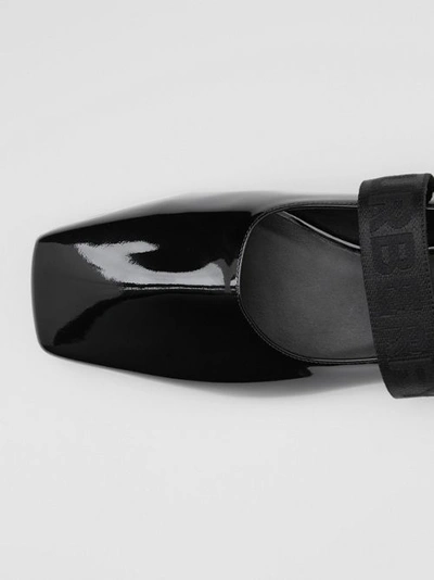 Shop Burberry Logo Detail Patent Leather Flats In Black