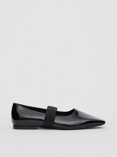 Shop Burberry Logo Detail Patent Leather Flats In Black