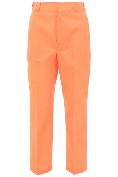 Shop Prada Nylon Gabardine Trousers In Orange