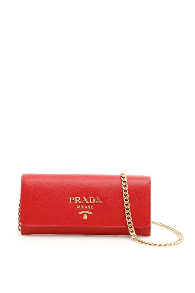 Shop Prada Saffiano Clutch With Strap In Red