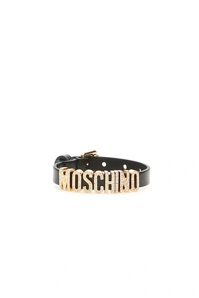 Shop Moschino Crystal Lettering Bracelet In Black,gold