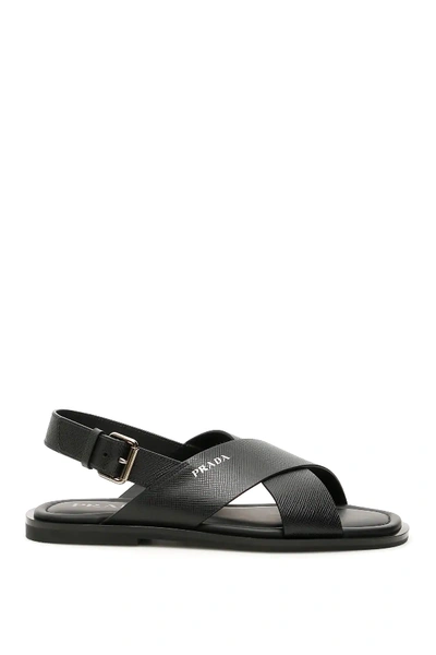 Shop Prada Criss-crossing Sandals In Black