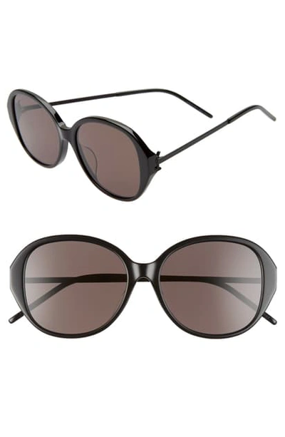Shop Saint Laurent 57mm Round Sunglasses In Shiny Black/black