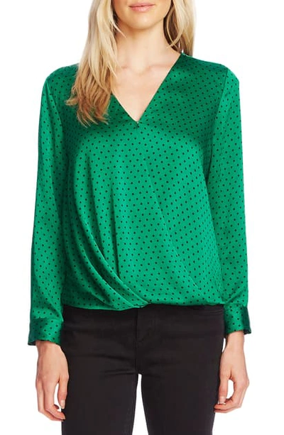 Shop Vince Camuto Fiesta Dot Wrap Front Long Sleeve Hammered Satin Blouse In Everglade