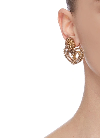 Shop Oscar De La Renta Loop Heart Embellished Earrings In Metallic