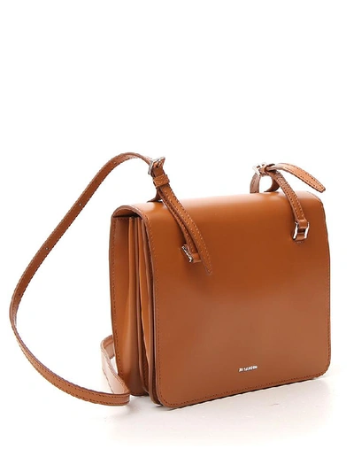 Shop Jil Sander Foldover Logo Shoulder Bag In Brown