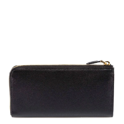 Shop Prada Zipped Saffiano Wallet In Black