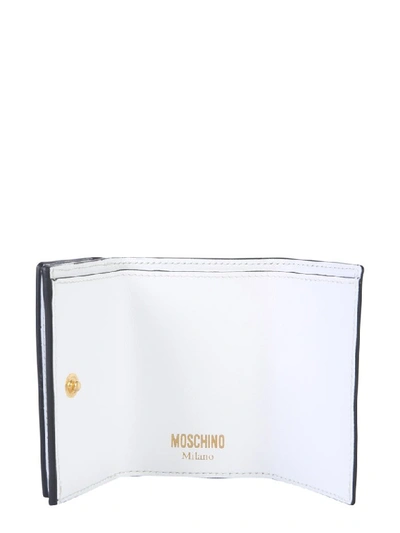 Shop Moschino Logo Print Leather Wallet In White