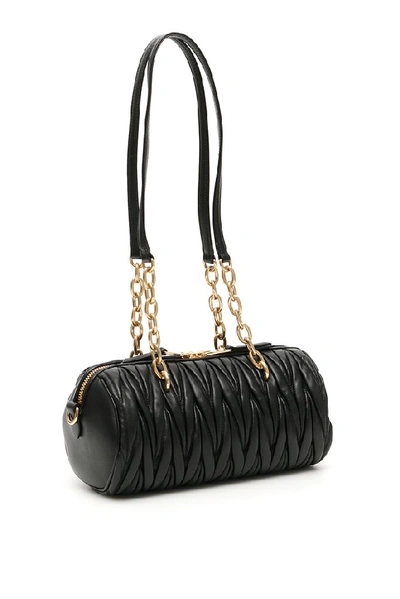 Shop Miu Miu Matelassé Logo Shoulder Bag In Black