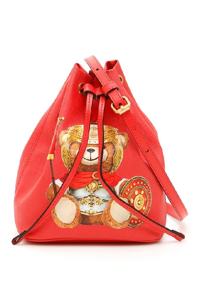 Shop Moschino Teddy Embossed Logo Bucket Bag In Red