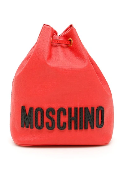 Shop Moschino Teddy Embossed Logo Bucket Bag In Red