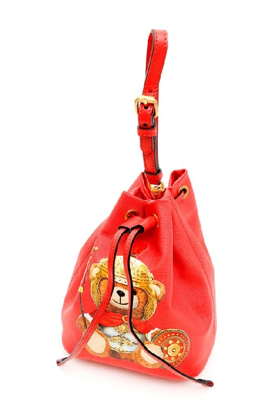 Shop Moschino Teddy Embossed Logo Bucket Bag In Red