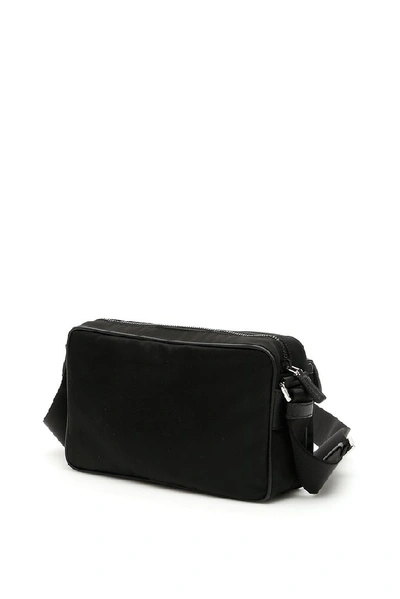 Shop Prada Saffiano Logo Messenger Bag In Black