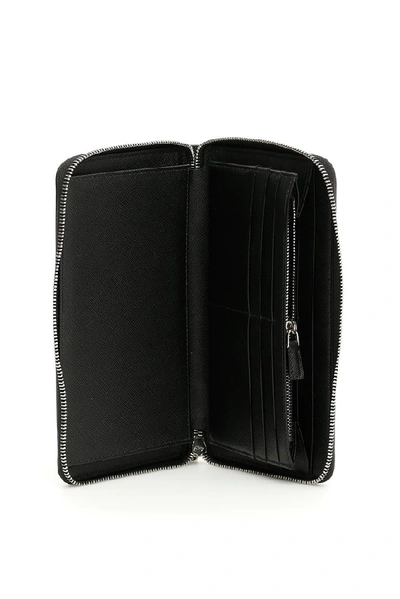 Shop Prada Saffiano Zip Around Wallet In Black