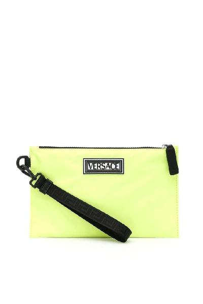 Shop Versace Logo Nylon Clutch Bag In Yellow