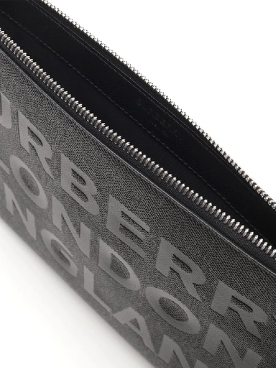 Shop Burberry Printed Zipped Clutch Bag In Black