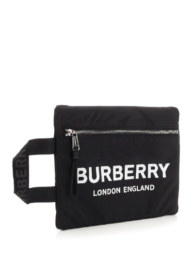 Shop Burberry Logo Print Clutch Bag In Black