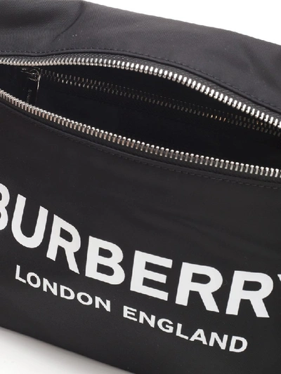 Shop Burberry Logo Print Clutch Bag In Black