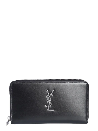 Shop Saint Laurent Monogram Zipped Wallet In Black