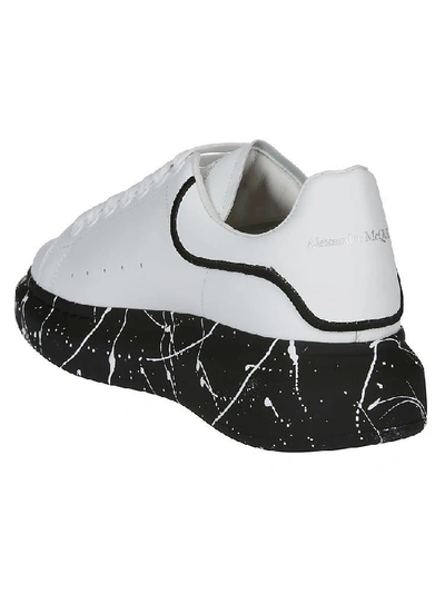Shop Alexander Mcqueen Contrast Sole Sneakers In White/black