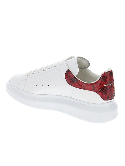 Shop Alexander Mcqueen Embossed Snake Print Oversized Sneakers In White/red