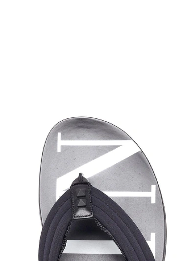 Shop Valentino Garavani Vltn Flip Flops In Black